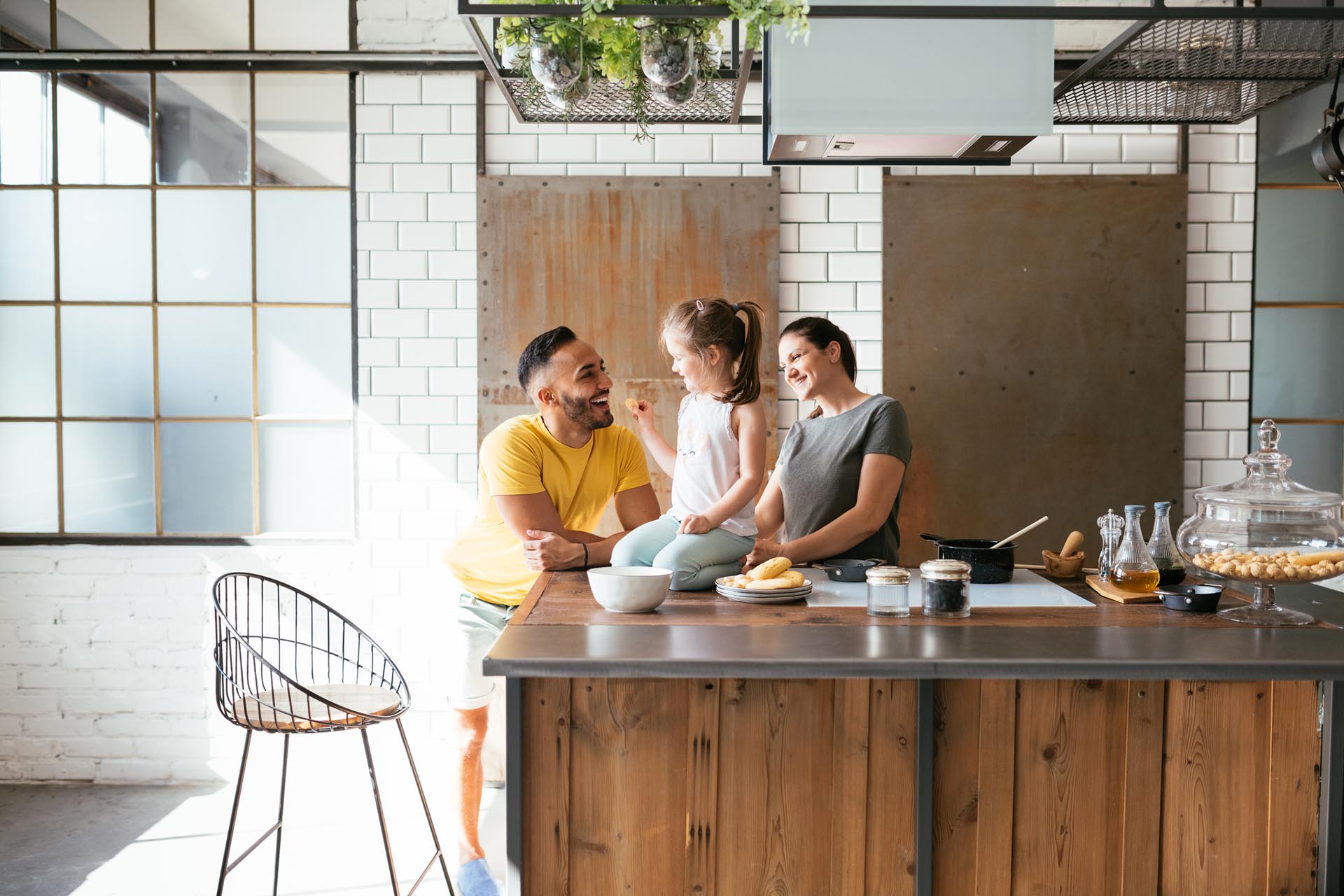 family eating snacks on kitchen island
