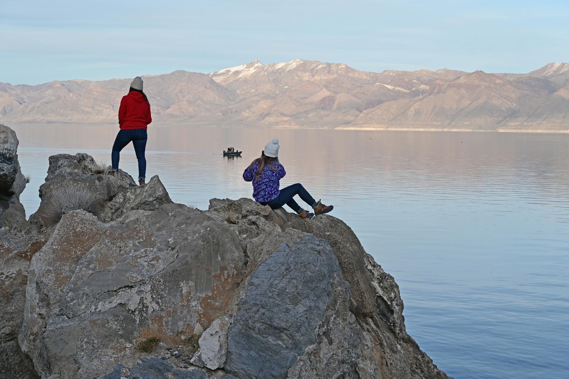 woman and daughter sitting at pyramid lake